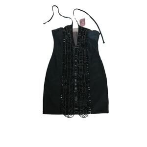 Black dress adorned with silver beads, size M, Made in Brazil, Stretch PU fabric